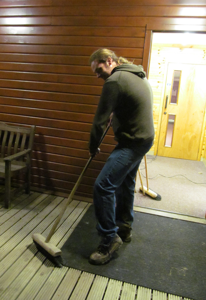 Adam brushing the outside mat